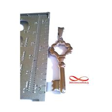Pendentif Clé En Acier Inoxydable Argenté au meilleur prix au Maroc